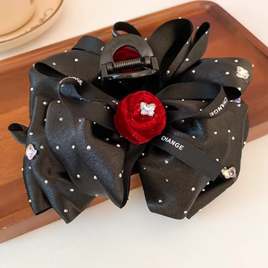 Elegant large black fabric bow hair claw clip with red velvet rose and rhinestone detail