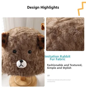 Detail of plush brown bear bucket hat featuring 3D ears with leopard print lining