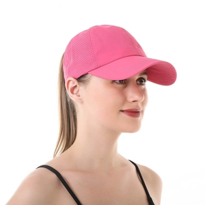 Detail view of the breathable mesh fabric and ponytail hole on this rose pink baseball cap