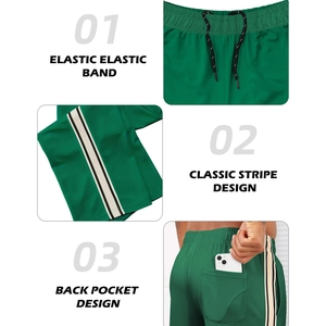 Men's emerald green mesh sports shorts with elastic waist and side stripe details