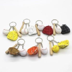 Detailed view of baseball keychain set with leather glove, wooden bat and mini ball