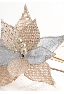 Detail of burlap Christmas artificial flower with champagne gold petals and glitter edges