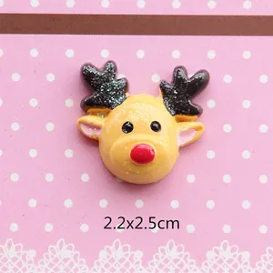 Macro shot of 2.2x2.5cm Christmas reindeer resin flatback charm with glitter details
