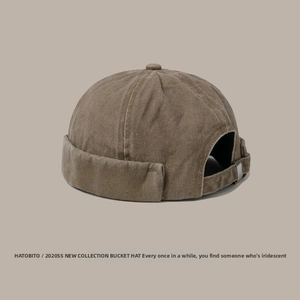 Detail of vintage brown cotton miki hat with canvas texture and metal adjuster buckle
