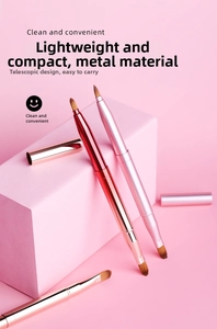 Detail of retractable metal lip brushes with caps in elegant rose gold and pink
