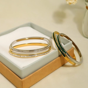 Minimalist gold and silver plated stainless steel bracelets with sparkling emerald zircon