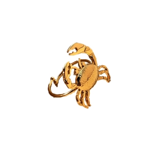 Minimalist golden stainless steel crab ring with polished finish on a white background