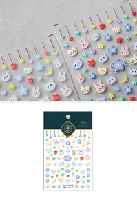 Detailed view of 5D embossed nail art stickers with cute rabbit and floral designs
