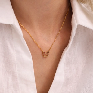 Golden stainless steel butterfly necklace with colorful zircon stones on female model