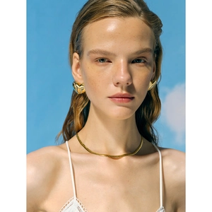 18k gold plated stainless steel heart earrings and sleek snake chain necklace on model