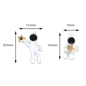 DIY astronaut pendants with gold star accents in two poses with detailed size measurements