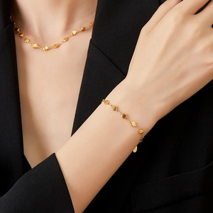 18K gold plated stainless steel necklace and bracelet set featuring shiny disk charms