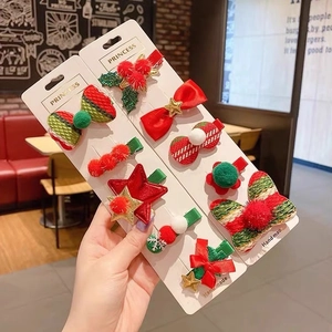 Five-piece Christmas hair clip set for kids featuring festive trees and bows