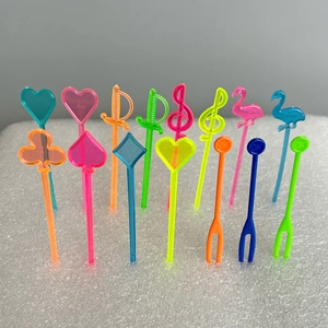 Detailed view of colorful assorted disposable plastic fruit picks with creative patterns