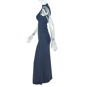 Detailed side view of black high neck sleeveless dress on model showing slim fit