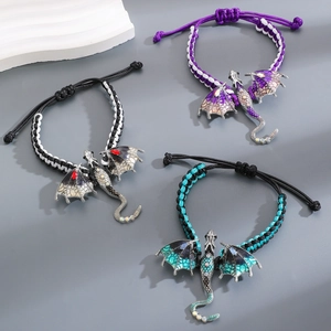Three vintage braided bracelets with enamel dragon charms in purple black and cyan