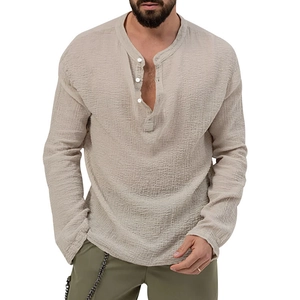 Detail of men's beige Henley shirt featuring a textured crinkle fabric and buttoned collar