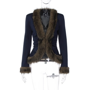 Detailed view of women's slim fit dark blue jacket featuring luxury brown faux fur trim