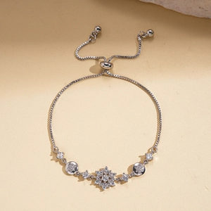 Detail of adjustable snowflake bracelet with zircon inlays and elegant silver box chain