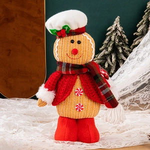 Standing gingerbread man chef doll with red hat and scarf for Christmas table decor
