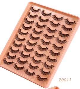 Close-up of 20 pairs of dense natural synthetic eyelashes in a pink tray