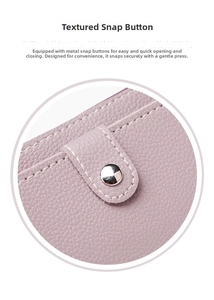 Detail of premium grain leather texture and durable silver metal snapper closure
