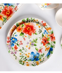 Macro detail of hand-painted floral ceramic plate with vibrant watercolor patterns