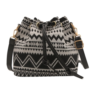 Vintage bohemian drawstring bucket bag with black and white geometric woven pattern