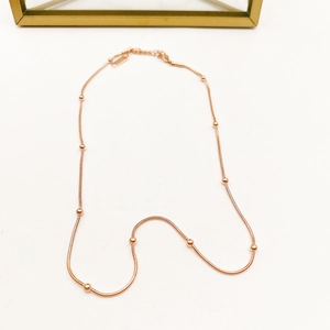 Elegant 18K rose gold bead snake chain necklace with adjustable clasp on white background