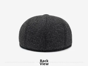 Detailed back view of a men's winter flat cap with thick dark grey wool-blend texture