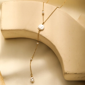Elegant gold plated stainless steel Y-lariat necklace with white baroque pearls