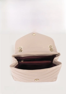 Top view showing multiple interior compartments of a beige quilted chain crossbody bag