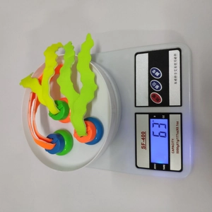 Three-piece colorful diving seaweed toys for pool training weighing 63g on a scale