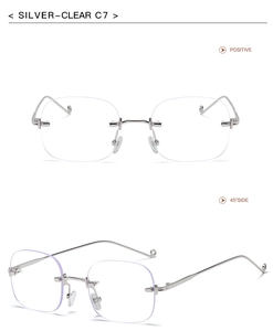 Detail view of silver rimless square sunglasses with clear lenses and metal temples