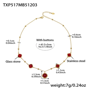 Detailed view of gold stainless steel necklace with five square red glass stones and sizes