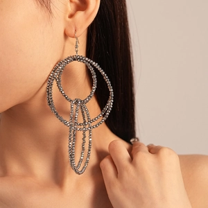 Chunky gunmetal multilayer glass bead hoop earrings with long fringe on model