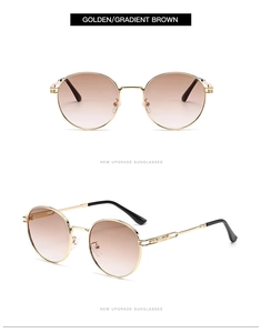 Close-up of retro round golden metal frames with gradient brown lenses and hinge details