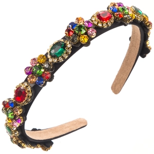 Macro view of colorful crystal floral embellishments on a baroque headband detail