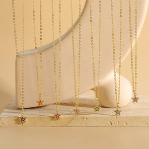Vertical display of seven colorful star zircon pendants on gold chains for women