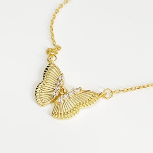 Golden butterfly pendant necklace made of 925 sterling silver with sparkling crystals