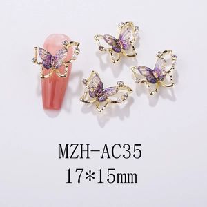 Macro view of purple 3D butterfly nail charms with gold edges and pearl accents
