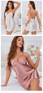 Detail showing backless satin slip dress with crisscross straps and bow decoration