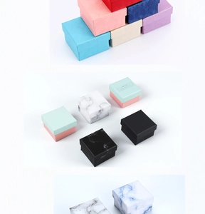 Collection of square jewelry gift boxes in various colors and marble textures for rings