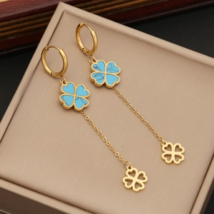 Long gold tassel earrings featuring blue turquoise clover motifs and hollow clover charms