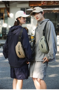 Detail of khaki and green nylon crossbody bags showing adjustable straps and sturdy buckles