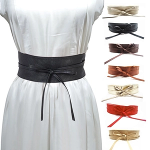 Macro detail of multi-color wide waist belts for women with tied bowknot design