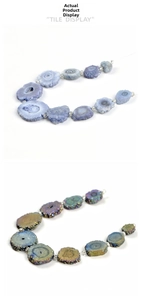 Detailed view of irregular natural agate slices and iridescent electroplated crystal beads