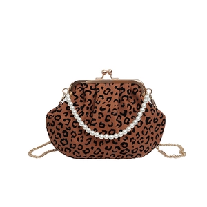 Retro leopard print shell bag with large pearl handle and gold chain shoulder strap