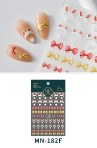 Gros plan de stickers à ongles 3D en relief avec nœuds rouges et motifs oreilles de lapin