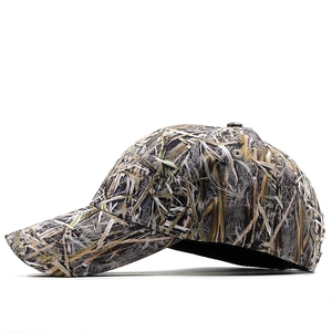Detail view of the dry grass camouflage pattern on a curved brim baseball cap